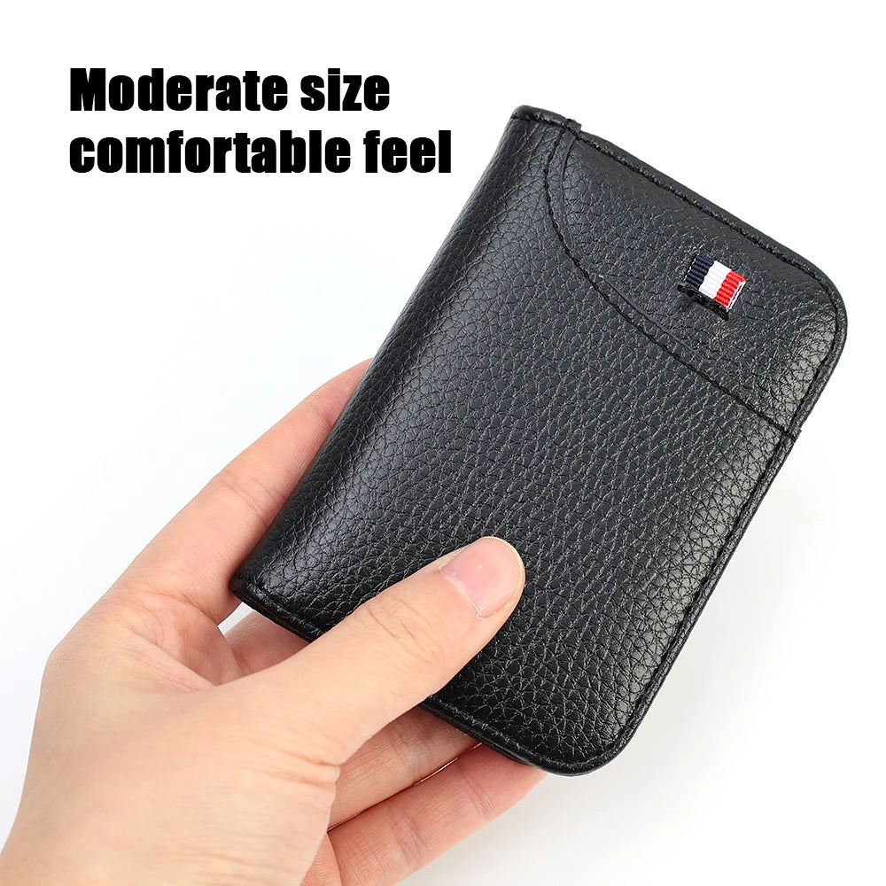 A hand holds a black slim PU leather credit card wallet for men, showing its size and texture.