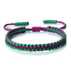 Handmade braided rope bracelet featuring green and purple threads.