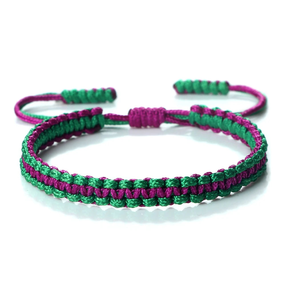 Handmade braided rope bracelet featuring green and purple threads.
