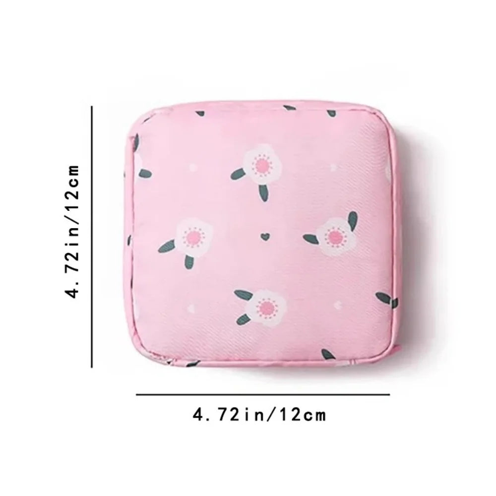 Pink portable waterproof sanitary napkin storage pouch with a floral pattern.