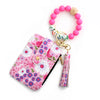 Pink floral silicone bead PU leather key chain wallet with a wooden bead charm and tassel.