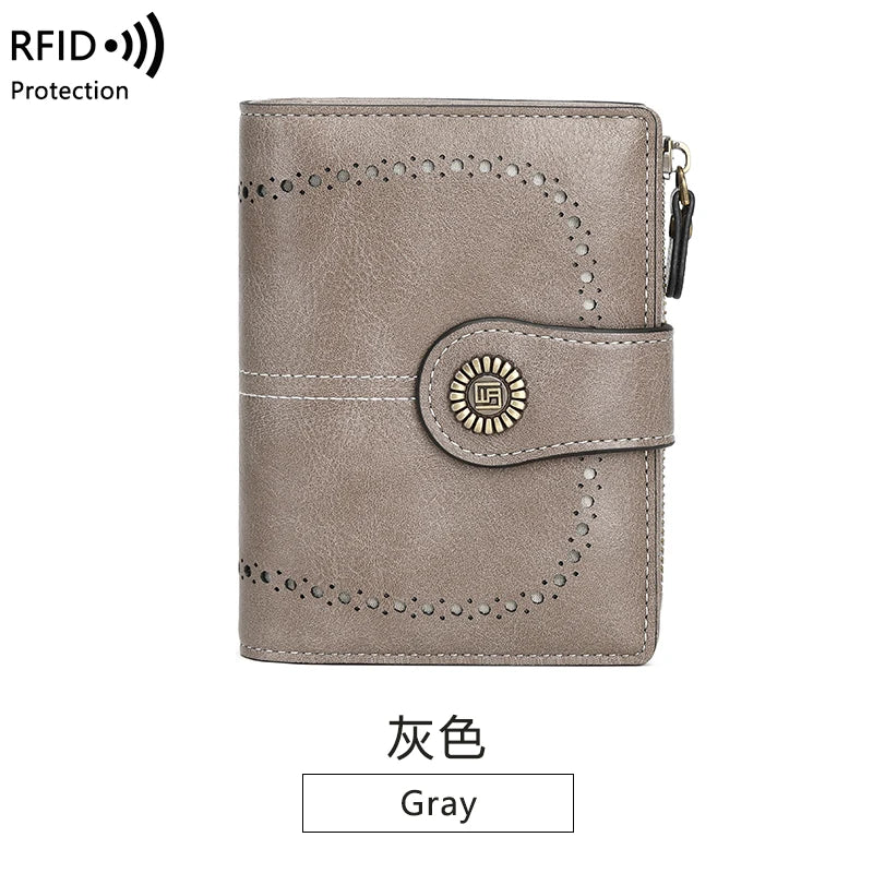 A gray multi-fold RFID protection wallet with a leather texture and a decorative emblem.
