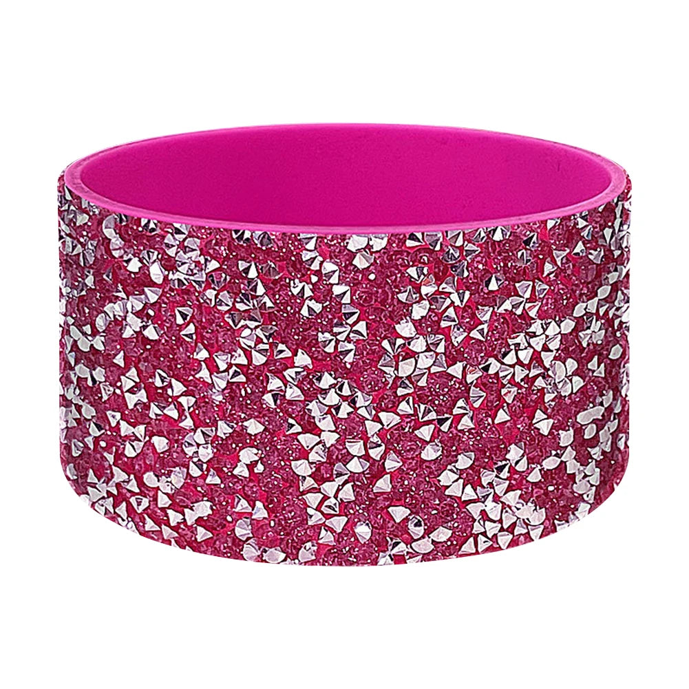 A bright magenta silicone boot sleeve designed to fit around a water bottle.