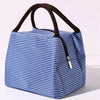 A blue and white striped insulated lunch tote bag with a black adjustable shoulder strap.