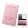 A pink passport wallet made of PU leather with a clear view of the inside containing a passport and cards.