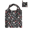 A black reusable nylon tote bag featuring a floral pattern of pink, gray, and white flowers.