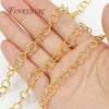 Several strands of 18K gold plated jewelry chains are displayed in a person's hand for crafting.