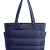A navy blue quilted tote bag with a handle is shown against a white background.