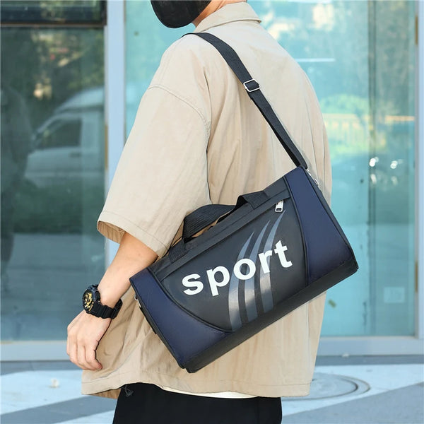 A person is holding a dark blue and gray sports backpack with white stripes, worn over a beige shirt.