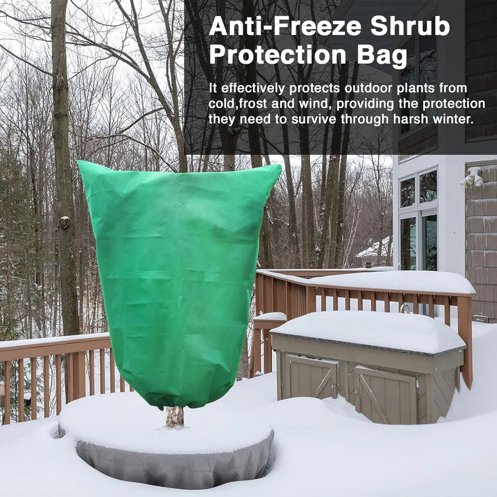 A green anti-freeze shrub protection bag is displayed in a snowy outdoor setting.