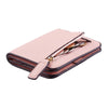 A pink compact bi-fold leather wallet with a dark brown trim and gold-toned coins visible inside.