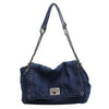 A dark indigo denim tote bag with a chain strap.