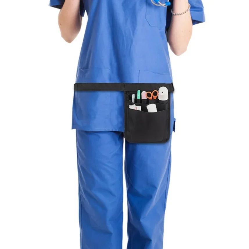 A person wearing a blue medical uniform is shown with a black organizer belt waist bag attached to their torso.
