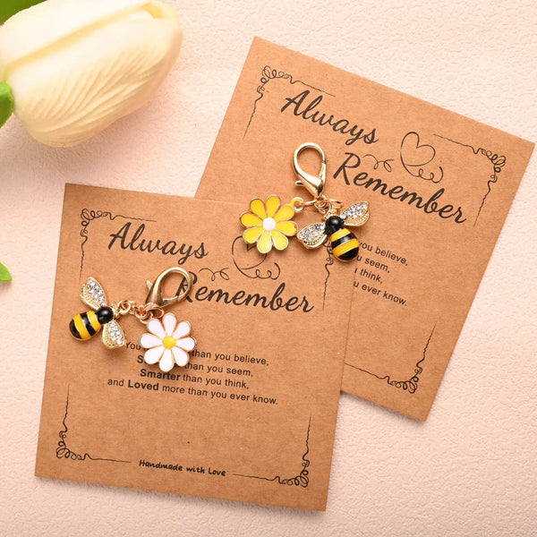 Two handmade cards featuring beaded flower keychains with the text Always Remember