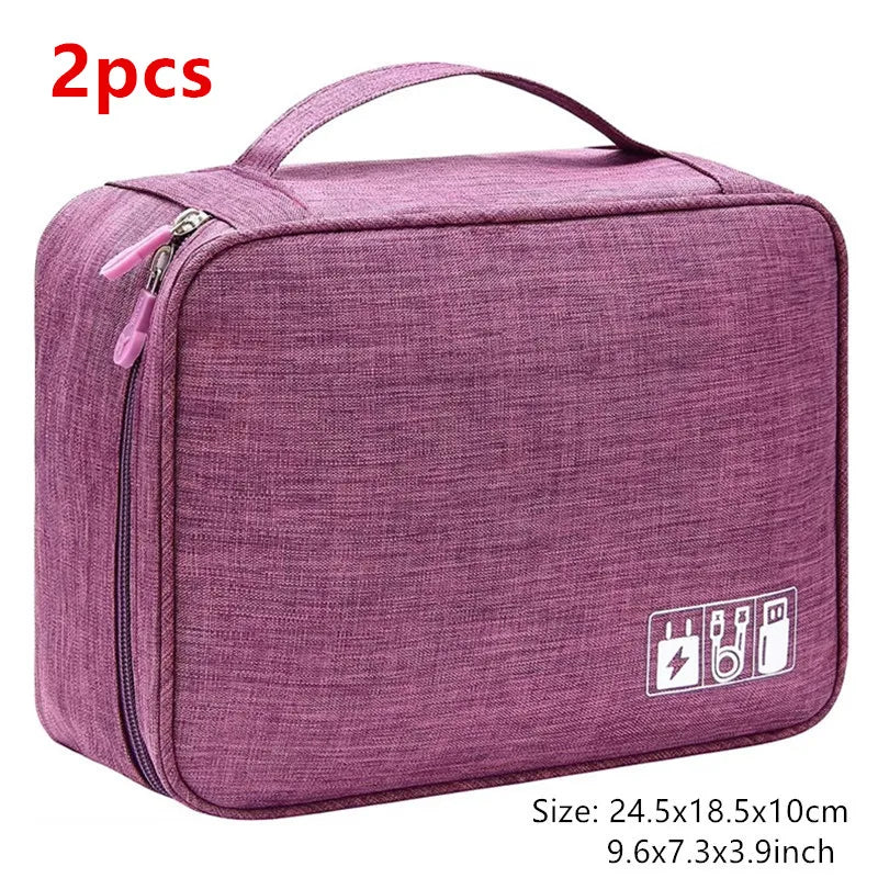 A purple portable digital organizer storage pouch with a zipper and handle, shown flat.