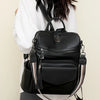 A woman is holding a black retro PU leather travel backpack with tassel details.