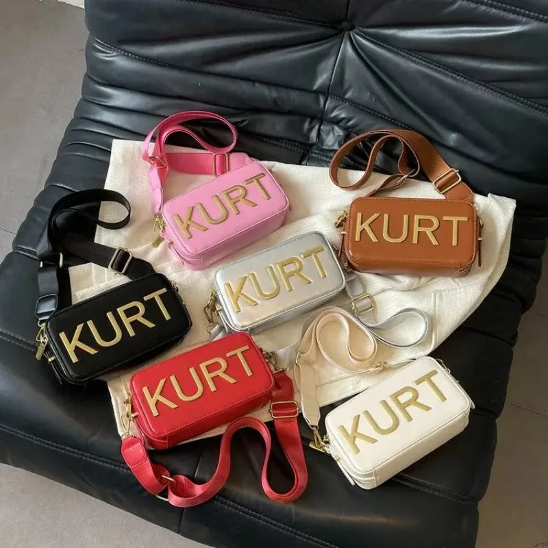 A collection of various colored leather tote bags displayed on a dark surface.