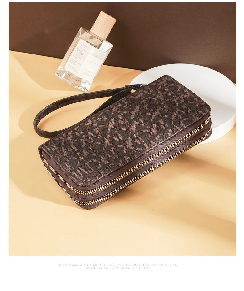 A brown patterned PU leather zippered wallet is shown next to a glass bottle.