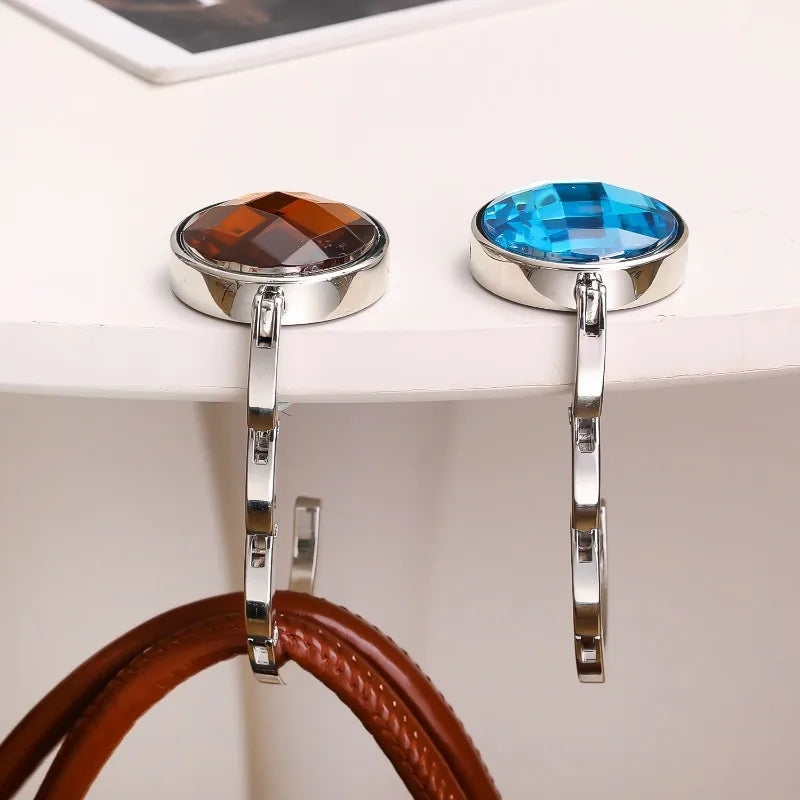 Silver-toned acrylic foldable hooks with round blue and amber gemstone accents
