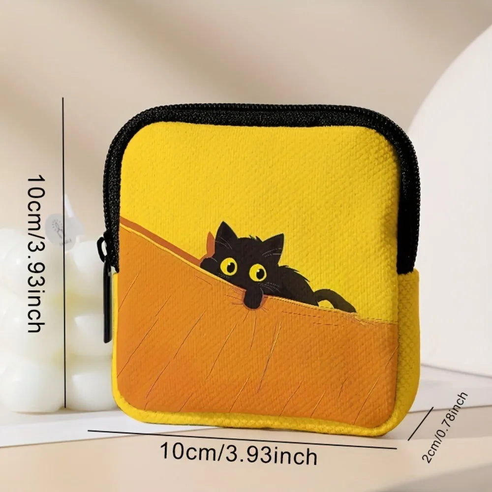 A yellow coin purse or multi-use earphone case featuring a black cat design on an orange background.