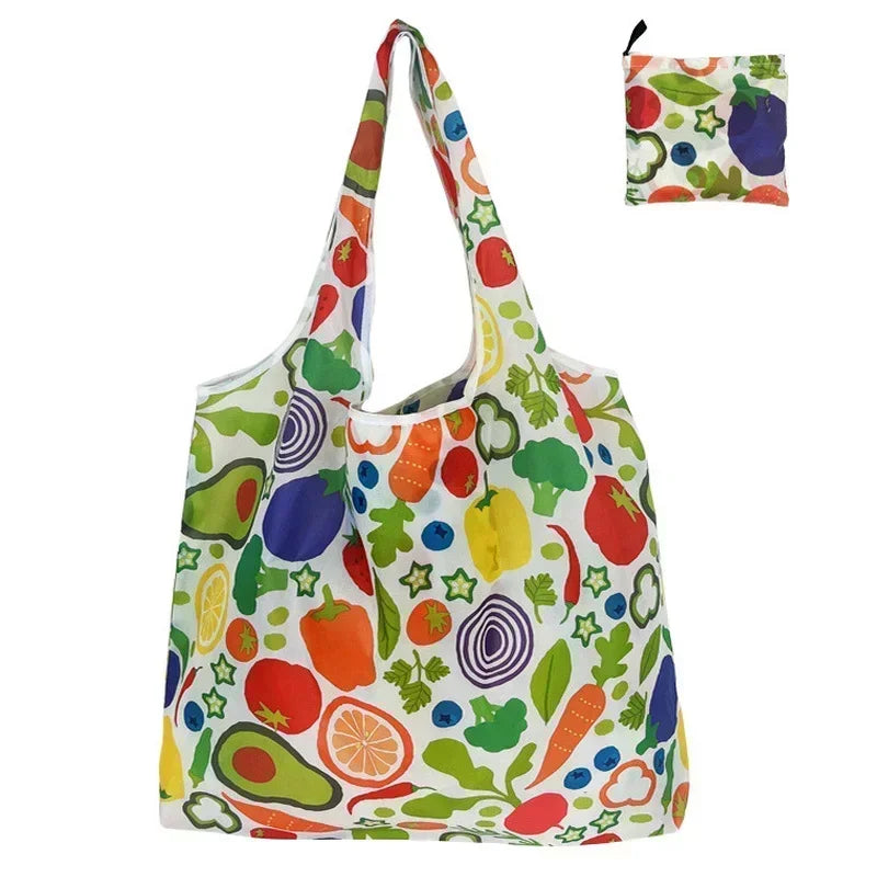 A colorful fabric tote bag featuring a print of various fruits and vegetables.