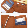 A brown leather document holder featuring slots for a passport and an SD memory card, alongside a pen.
