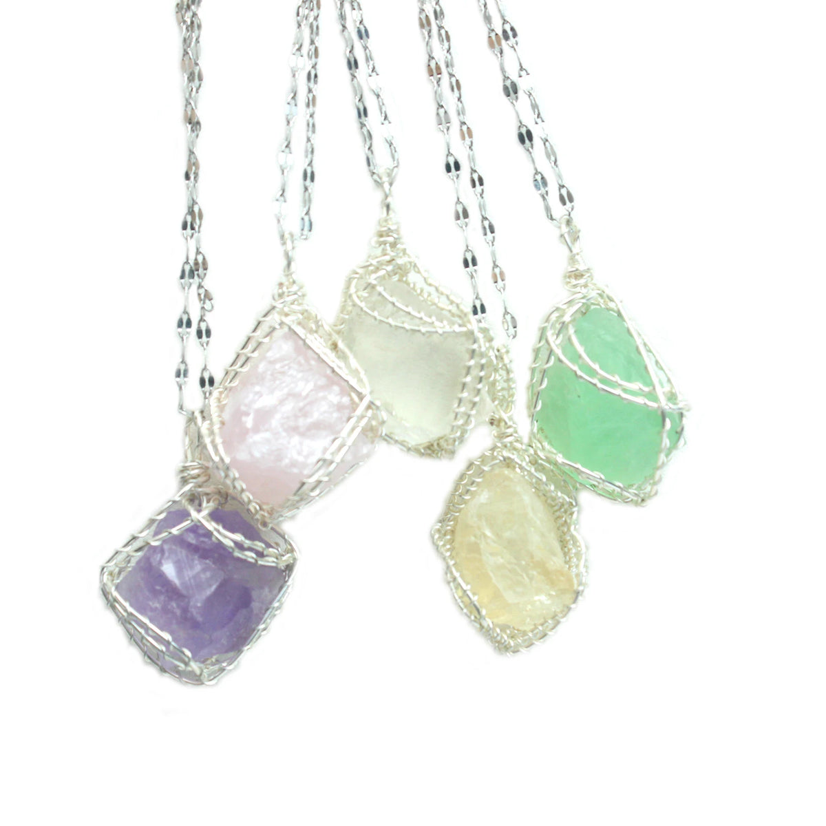 Handcrafted amethyst crystal pendant necklace featuring multiple faceted stones wrapped with copper wire.