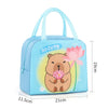 A light blue insulated lunch bag featuring a cute cartoon bear face and pink lotus flower design.