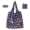 A reusable eco tote shopping bag featuring a dark blue fabric with colorful floral and geometric patterns.