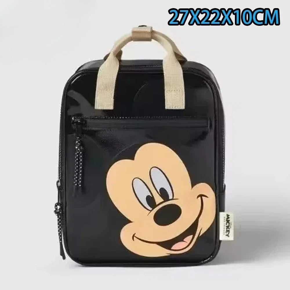 Mochila negra con diseño de cara de ratón de Disney.