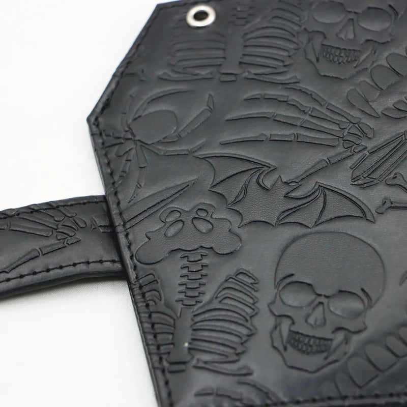 Black leather wallet featuring a vintage embossed design of skulls and skeletal elements.