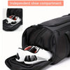 Black travel duffel bag with an independent shoe compartment showing a white and red sneaker inside.