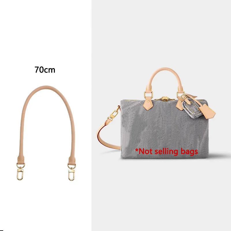 A light gray shoulder bag with a tan leather strap and decorative hardware.