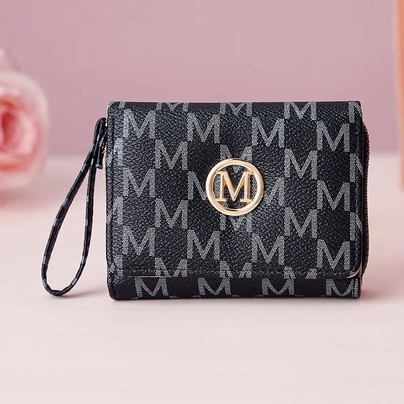 Black monogrammed letter zipper wristlet wallet with gold hardware