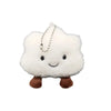 A white fluffy cloud shaped plush toy with a small silver chain hanging from it.