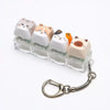 A set of acrylic cat keycaps used as a fidget toy attached to a silver metal lanyard.