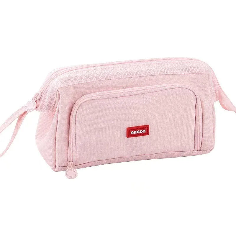 A pink multifunctional pencil case for students with a zipper closure and a hanging strap.