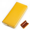 A yellow genuine leather zipper wallet shown with an open view of the interior.