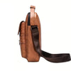 Sac bandoulière en cuir PU marron avec fermeture éclair et sangle réglable.