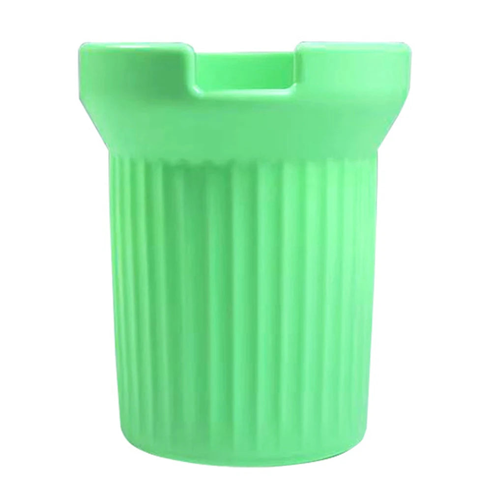 A bright green silicone boot sleeve designed to fit water bottles.