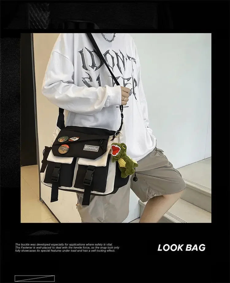 A woman wearing a white long-sleeved shirt holds a black nylon crossbody shoulder bag with green accents.