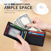 A hand holds a black carbon fiber wallet with an ID window, next to a cup and cash.