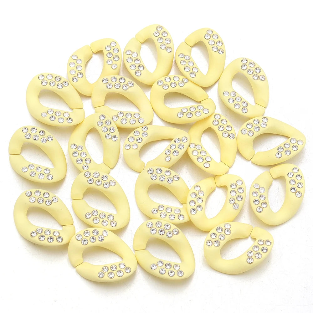 A collection of yellow acrylic link chain connectors for DIY jewelry and bag making
