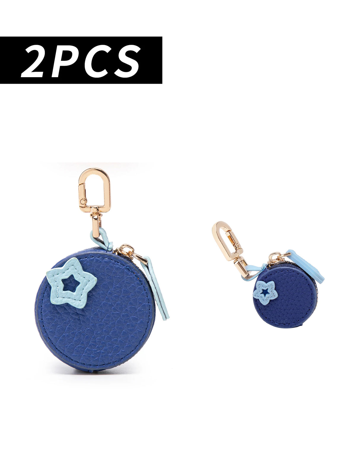 Two blue coin purse keychains featuring a star charm and a fruit shape on a light blue fabric.