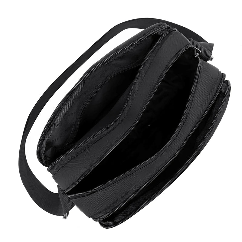 Black durable nylon shoulder bag with a zippered top and strap shown from above.
