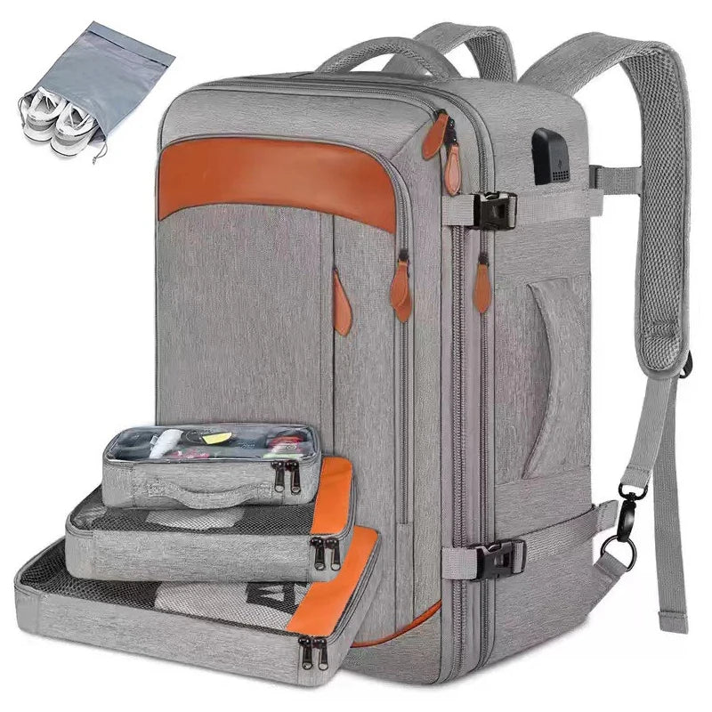 A gray expandable travel backpack with orange accents and multiple packing cubes visible.