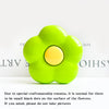 A bright lime green flower-shaped phone grip ring stand with small black dots on the surface.