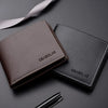 A brown and black PU leather folding wallet is shown on a dark surface with a ribbon in the background.