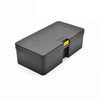 A black large capacity fishing tackle box with a yellow latch is shown from above.