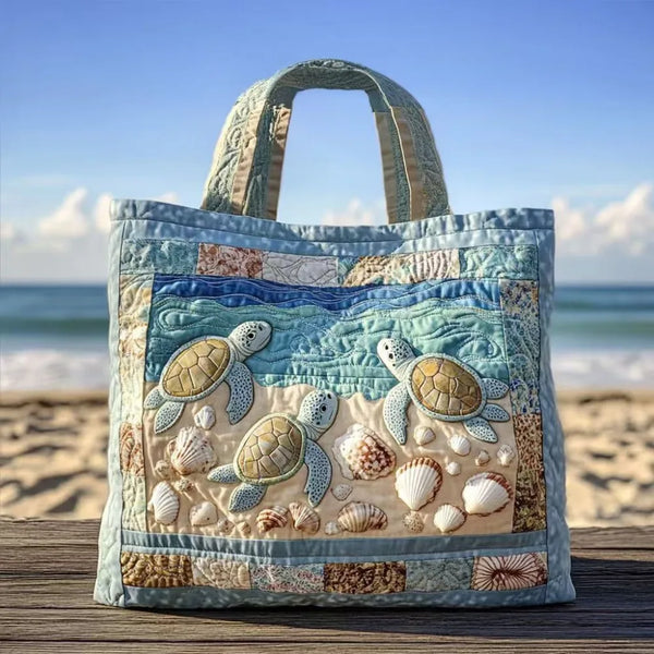 A quilted canvas tote bag featuring various sea turtle designs in pastel and earthy tones.
